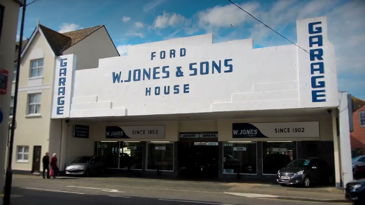 The vertical GARAGE lettering on the corner of W. Jones & Sons House